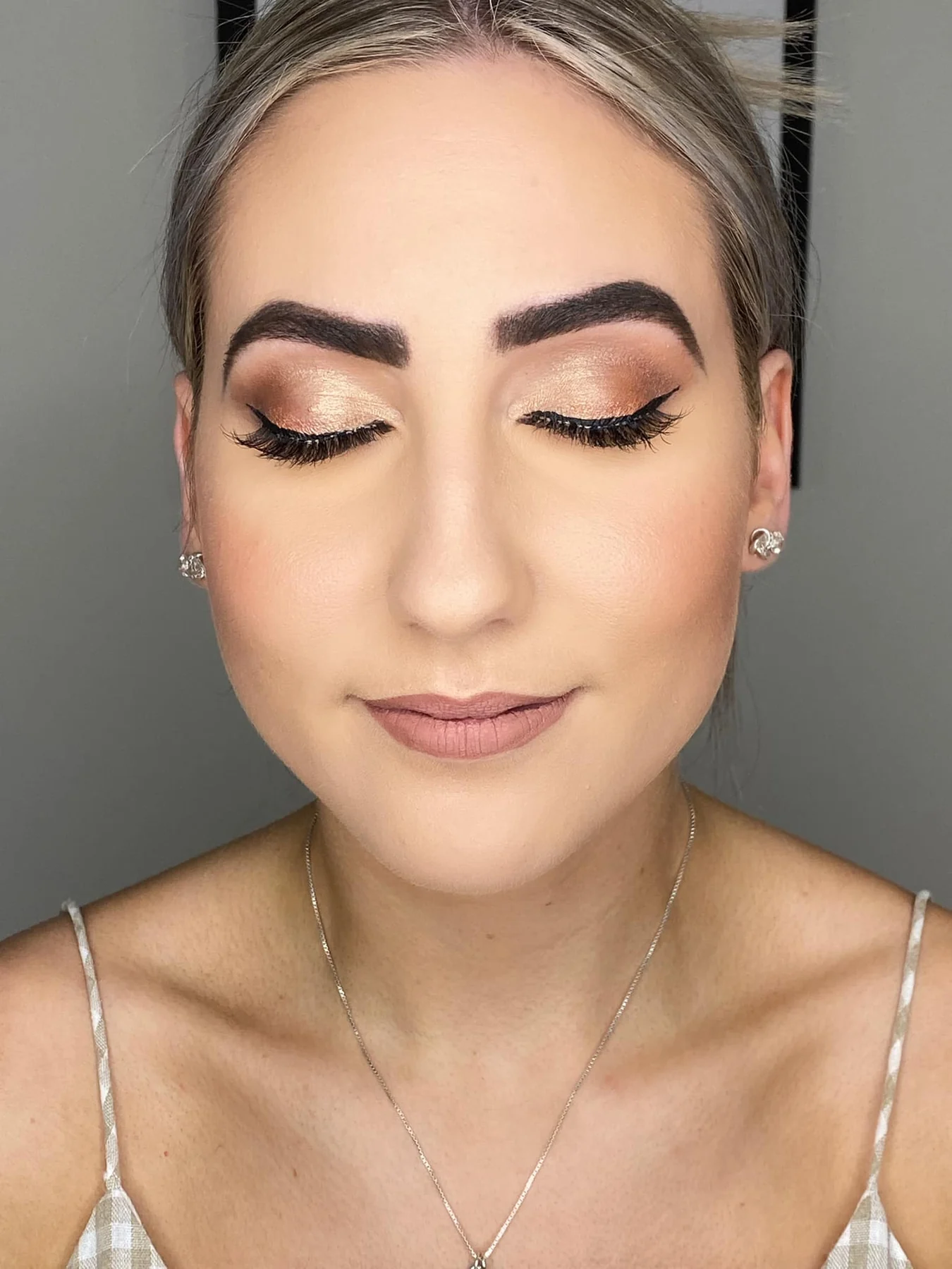 Warm bronze eye makeup with winged liner by Grace Studios CQ